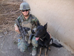A deployed service member with a military working dog