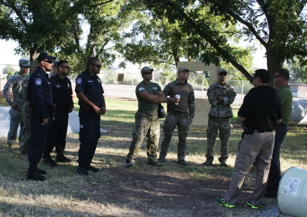 Law enforcement K9 officers gathered at an outdoor event